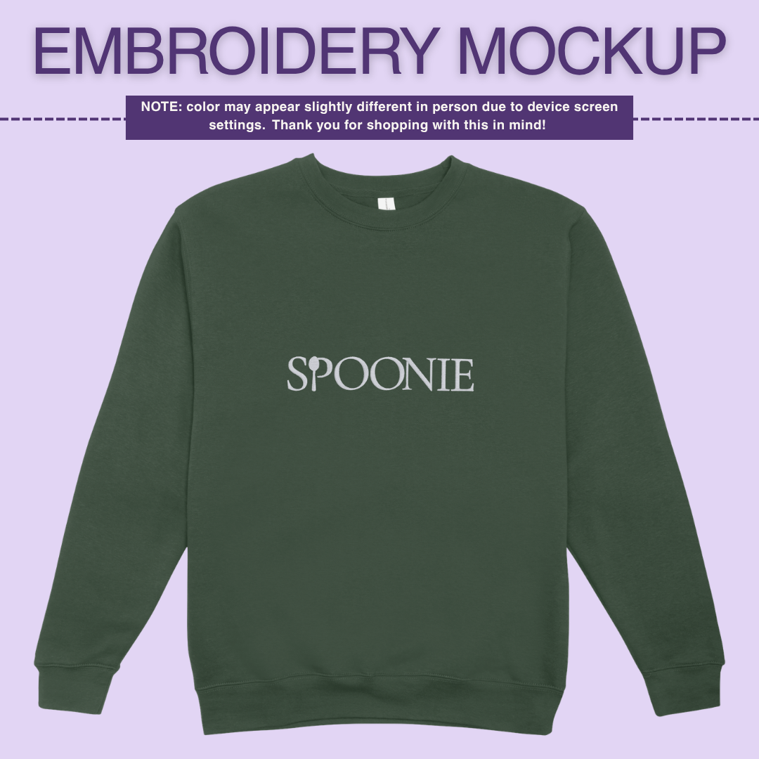 Dark green sweatshirt with 'SPOONIE' embroidery design on a light purple background