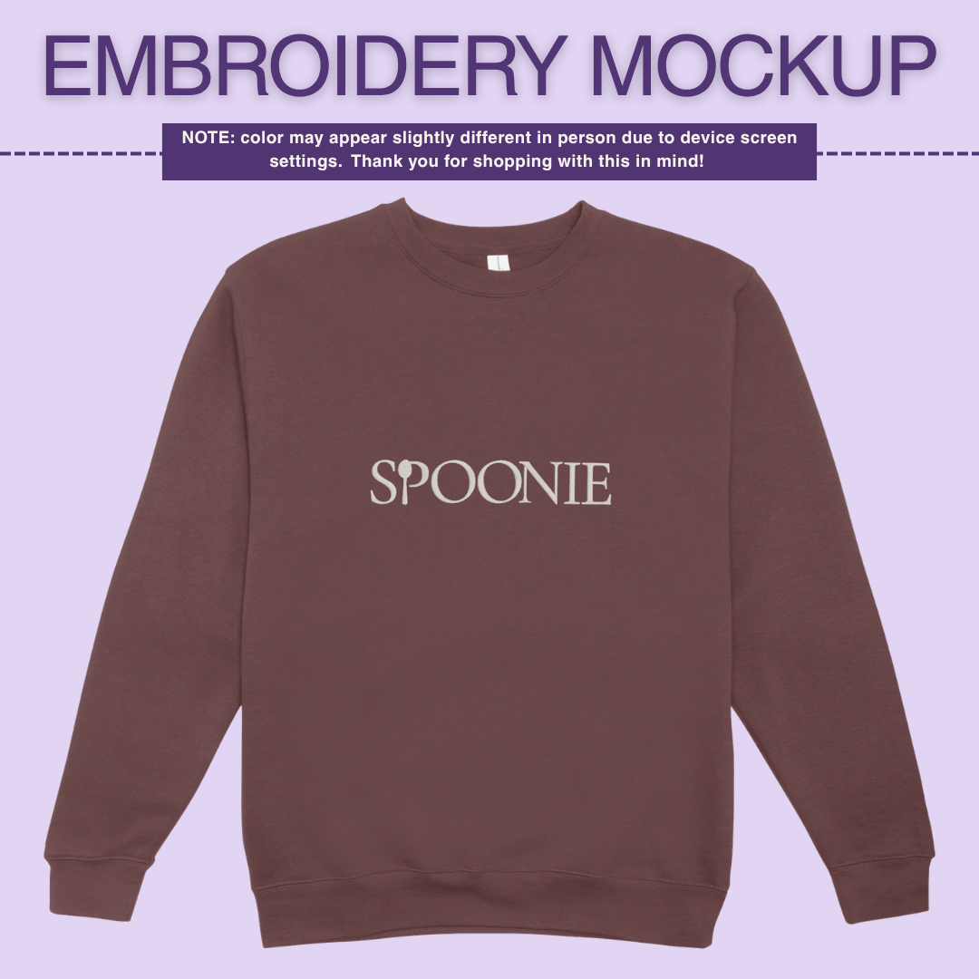 Dark maroon/brown sweatshirt with 'SPOONIE' embroidery design on a light purple background