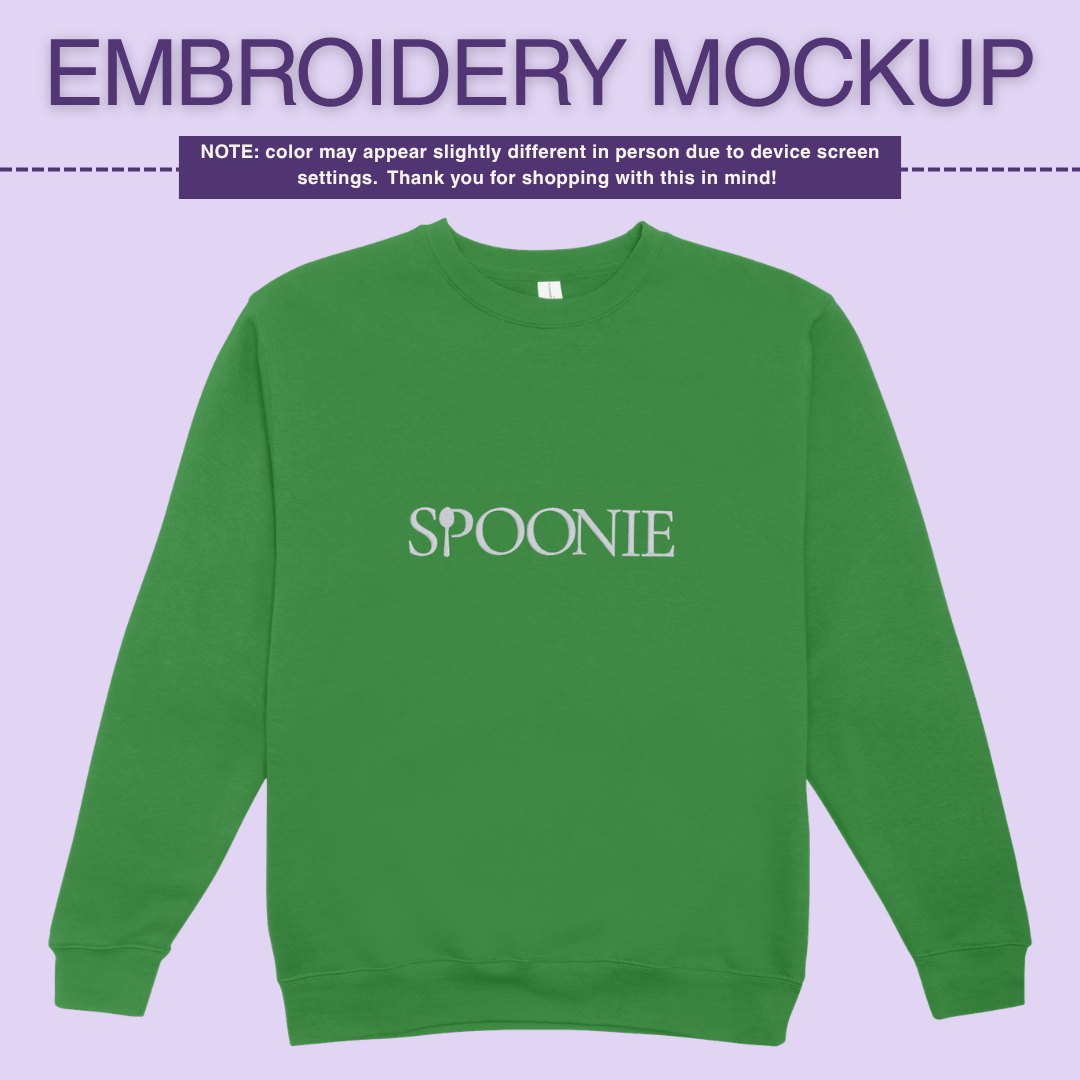 Green sweatshirt with 'SPOONIE' embroidery design on a purple background